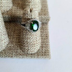 Sterling silver ring with green stone and clear rhinestones.